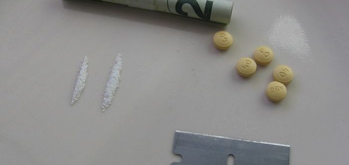 Oxycontin with a rolled up 20, lines and razor blade